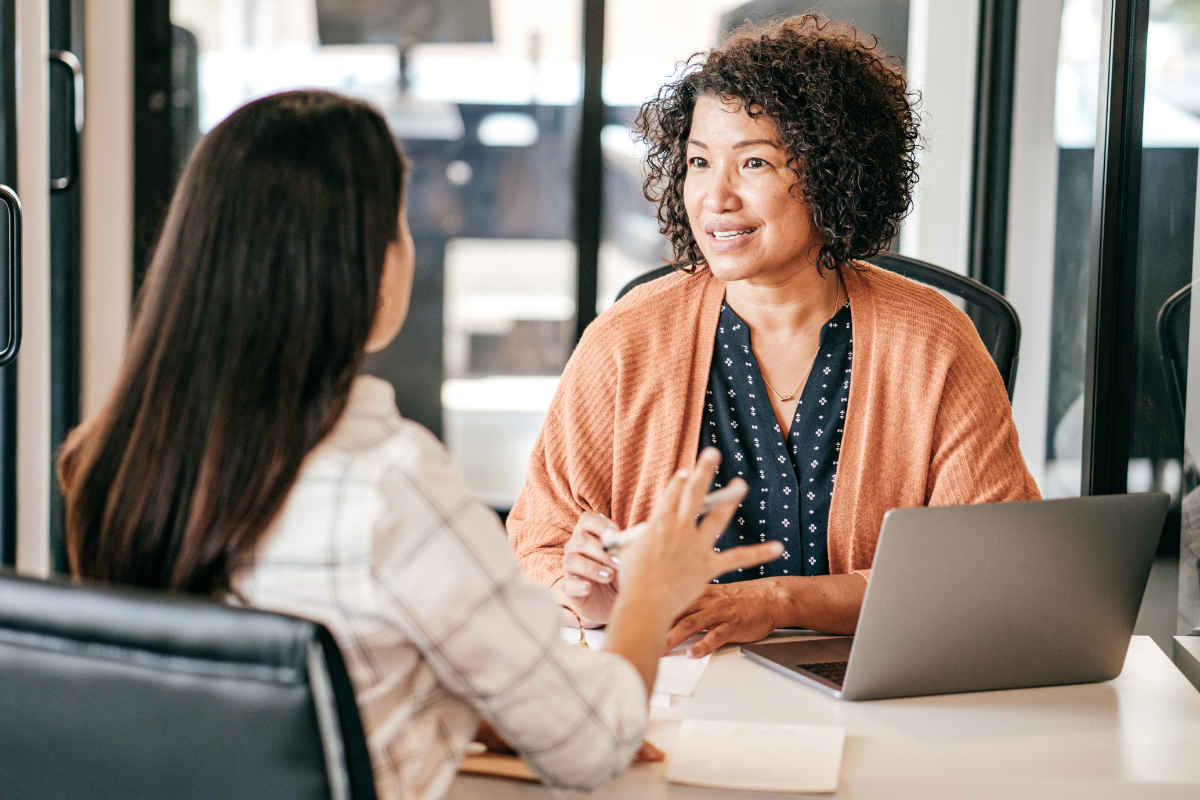 A woman being asked "What's your greatest weakness?" by a female job interviewer. A woman being asked "What's your greatest weakness?" by a female job interviewer.
